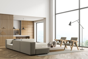 Corner view of beige and white panoramic living room with kitchen