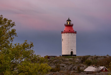 Lighthouse in Stockholm archipelago at sunrise. - 457763124