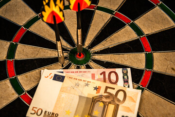 Money gambling. Darts and European money.