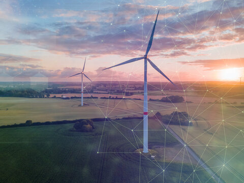 Wind turbines in fine weather with future icons in the sky.