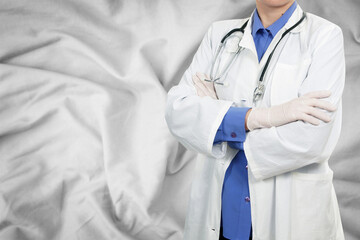 Doctor standing on silk background