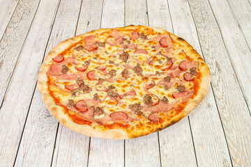 great pizza with bologna mortadella with roasted minced meat, sliced salami and lots of mozzarella cheese