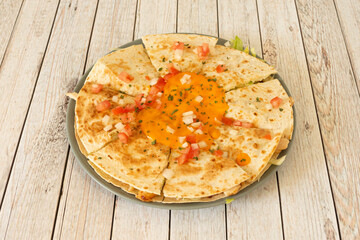 Mexican chicken quesadillas with melted cheddar cheese, cream cheese and pico de gallo