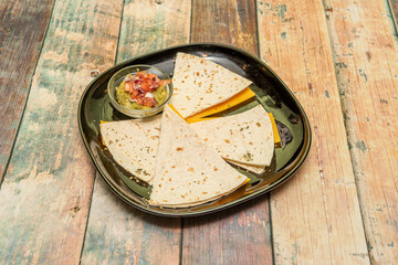 Ham and cheddar quesadillas with guacamole and pico de gallo