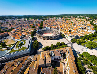 The aerial view of Arena of Nîmes, an old Roman city in the Occitanie region of southern France
