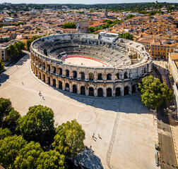 The aerial view of Arena of Nîmes, an old Roman city in the Occitanie region of southern France