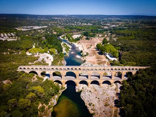 Wall murals Pont du Gard The aerial view of the Pont du Gard, an ancient tri-level Roman aqueduct bridge in France