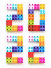 2022 New Year greeting card. Numbers made of colorful toy constructor blocks.