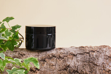 Cosmetic black cream jar Natural cosmetics concept.