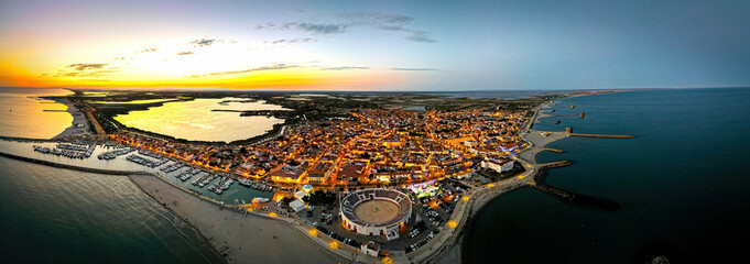 The aerial view of Saintes-Maries-de-la-Mer,  the capital of the Camargue in the south of France - obrazy, fototapety, plakaty
