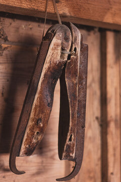 A pair of old ice skates on a wall