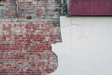 Full frame close-up view of a section of a brick building wall damaged by an earthquake