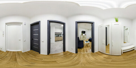 long white corridor in interior of entrance hall of modern apartments with open doors to the...