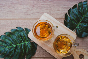 black hot tea in teacup served on table in cafe
