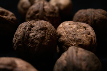 close-up of walnuts isolated on black background