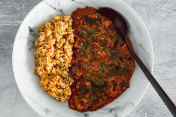 vegan eggplant lentil curry with brown rice, healthy plant-based food