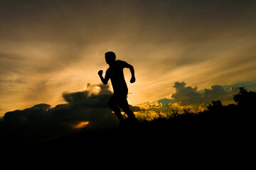 Man silhouette running on sunset.