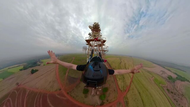 Viewpoint of a Base jumper jumping from an antenna. Special 360 degree image. Mini planet miniature.