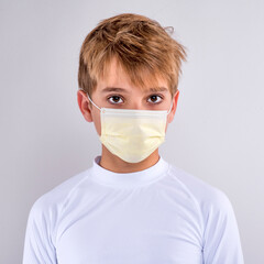 Young Boy Wearing Face Mask White Background