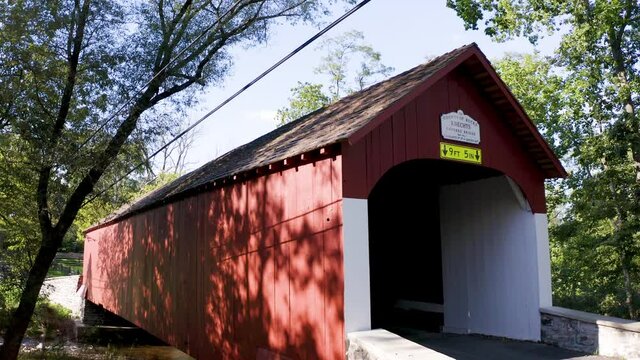 KNECHT'S COVERED BRIDGE IN BUCKS COUNTY, PENNSYLVANIA. BUILT IN 1873. NATIONAL REGISTER OF HISTORIC PLACES.  CROSSES COOKS CREEK. 110ft long 15ft wide.