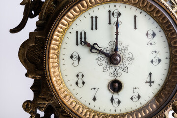 Fototapeta na wymiar A modern, serially aged bronze watch, based on an original German model from the mid-19th century