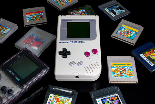 Fukuoka, Japan - september 19, 2021 : nintendo game boy and game boy color with various game cartridges isolated on black background 