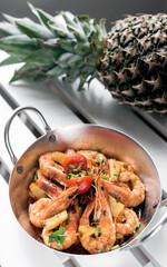 spicy sauteed asian stir fry king prawns with pineapple