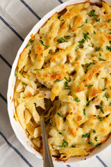Homemade Chicken Alfredo Pasta Bake with Parsley, top view. Flat lay, overhead, from above.
