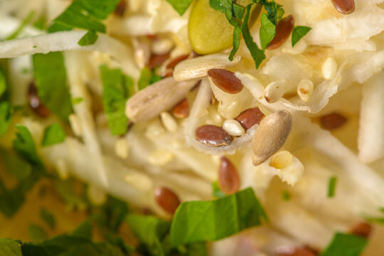 Fresh healthy vegan salad with celery and various seeds. High resolution close up macro photo