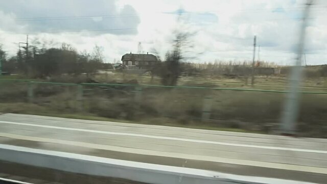 View of outside landscape, shot from running Super fast bullet train from Moscow to St. Petersburg.