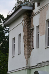 Fallen off plaster from a brick wall.