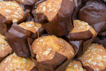 Sweet muffins with nuts. Brown paper cupcake cups. Quick bread concept.