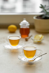 Obraz na płótnie Canvas tea drinking in transparent glass dishes