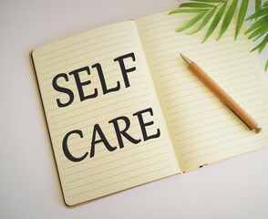 Self care inspirational reminder written in Notebook, Conceptual hand writing showing Self care. Business photo text focused on own well-being and happiness, in particular during periods of stress