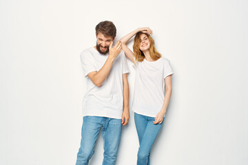 young couple in white t-shirts and jeans Friendship on emotions mockup