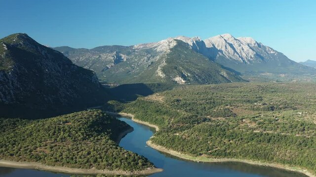 View from above, stunning aerial view of the Cedrino Lake - Lago del Cedrino, surrounded by the mountain range of Supramonte located northeast of the Gennargentu massif. Sardinia, Italy.