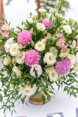 Beautiful floral compositions in the restaurant for the wedding ceremony