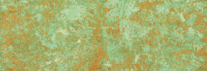 motley damaged stucco wall with cracks and peeling paint flakes