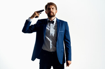 Naklejka premium Man Secret agent with a gun in the hands of a crime isolated background