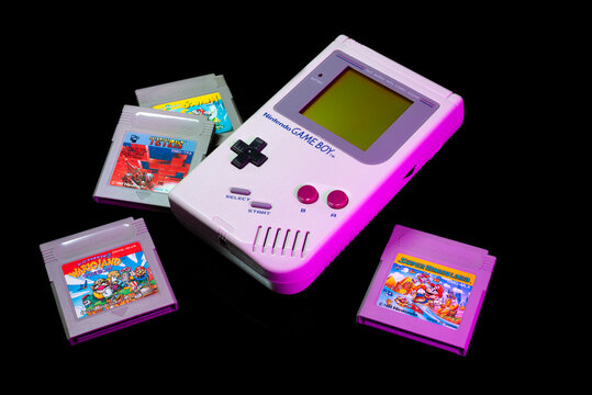 Fukuoka, Japan - september 19, 2021 : nintendo game boy and game boy color with various game cartridges isolated on black background 