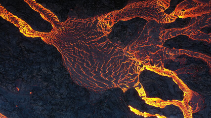 Aerial view over volcanic eruption, Night view, Mount Fagradalsfjall
lava spill out of the crater ...