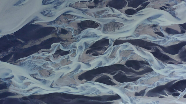 Aerial over Glacial rivers Meltwater mixed with natural mineral, Iceland
sediment in river deltas creating stunning pattern Iceland, Ljótipollur, September 2021 
