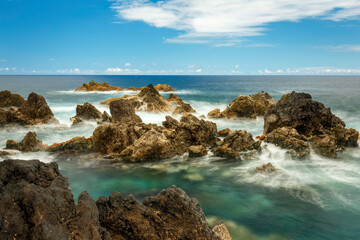 Porto Moniz natural pools, with horizon, soft ocean water and color