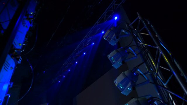Backsatage atmosphere before the show. Stage is flooded light. Amazing abstractive loop on the big LED screen.