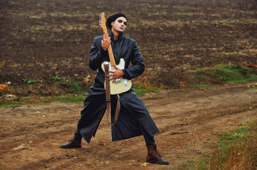 Portrait of a rock musician in nature