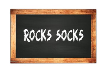 Obraz premium ROCKS SOCKS text written on wooden frame school blackboard.