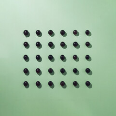 Grapes arranged in a square. Minimalist autumn composition.