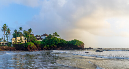 O Pescador beach resort with trees and clouds at sunset, Dona Paula Beach, Goa, India
