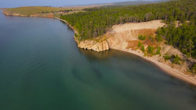 The picturesque shore of the Sarai beach. A trip to Lake Baikal.