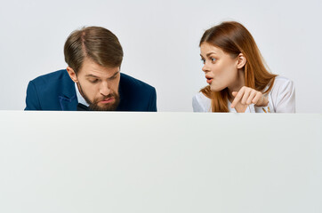 Man and woman advertising presentation white banner copy-space studio